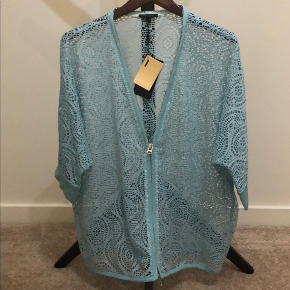 Light blue zip up short sleeve shell